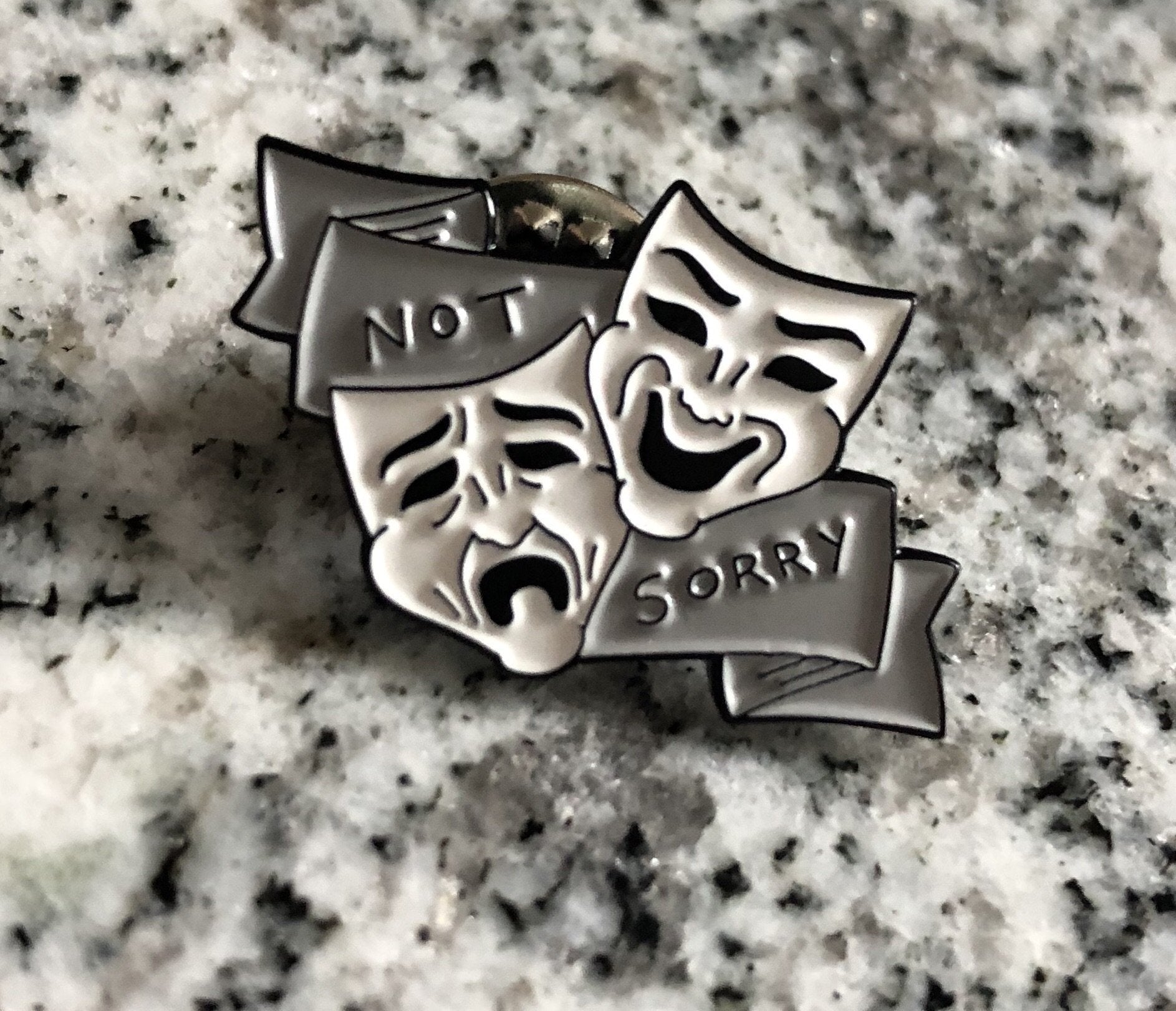 "Not Sorry" enamel pin