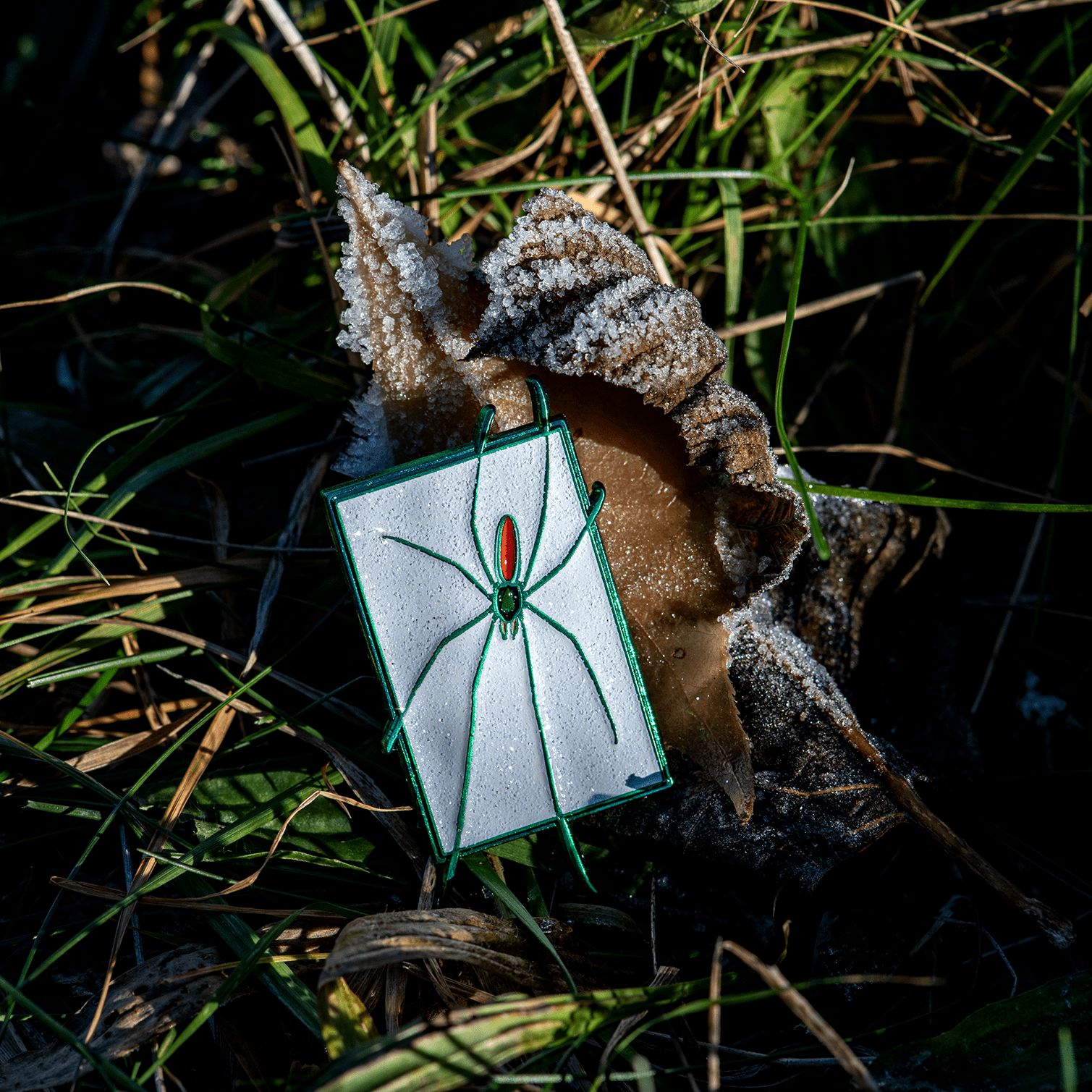 Green Spider in Snow Enamel Pin by The Roving House