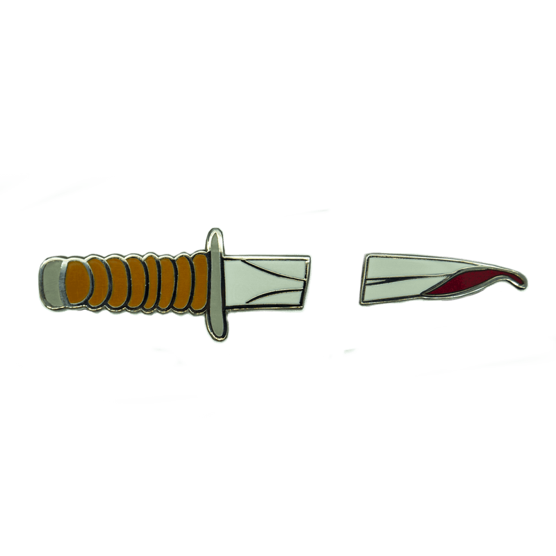 A set of two pins that look like a knife handle/base and bloodied tip.