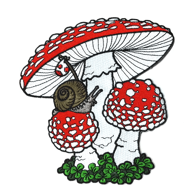 An large iron-on embroidered patch featuring artwork of a grey and brown snail carrying a bindle as he crawls over a trio of red and white fly agaric mushrooms and green moss.