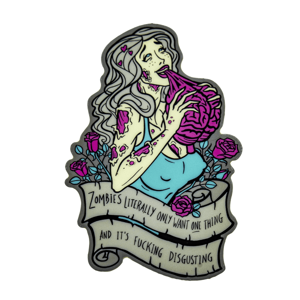 A vinyl glow in the dark sticker featuring the bust of a buxom, attractive female zombie with whitish green skin, grey hair, and neon pink wounds. She wears a cyan tank top and is surrounded by roses. She's eating a brain and her eyes are rolled back in her head, with pink hearts floating around her. A grey banner below her reads "Zombies literally only want one thing and it's fucking disgusting."