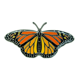 A life-sized orange, black, white, and silver monarch butterfly enamel pin on a white background.
