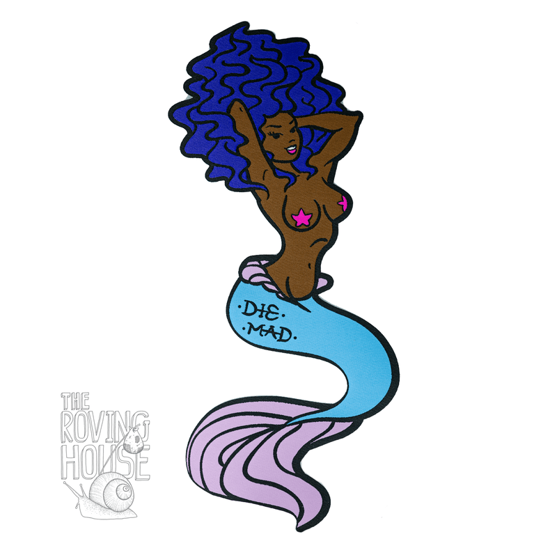 A large woven patch of a black femme mermaid with purple hair. She has a tattoo on her fish-butt that says "DIE MAD".