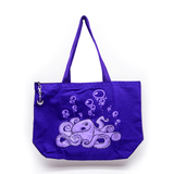 A violet and lavender tote bag featuring line art of an octopus and bubbles floating upwards. The zipper has a metal anchor shaped pull.
