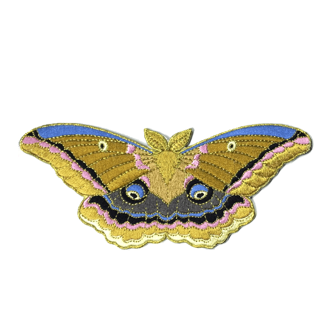 A soft embroidered patch of a polyphemus moth.